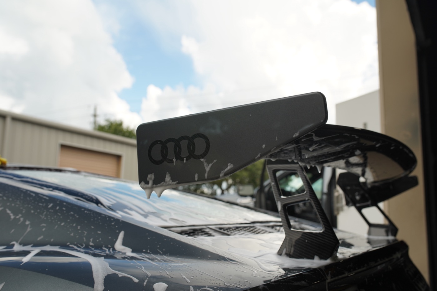 Close-up of an Audi spoiler being hand washed