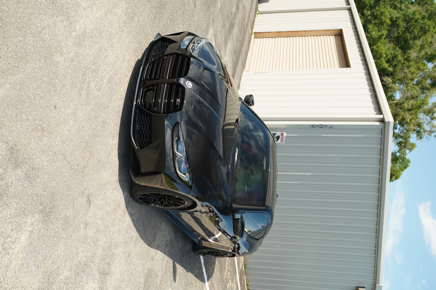Black BMW outside the shop