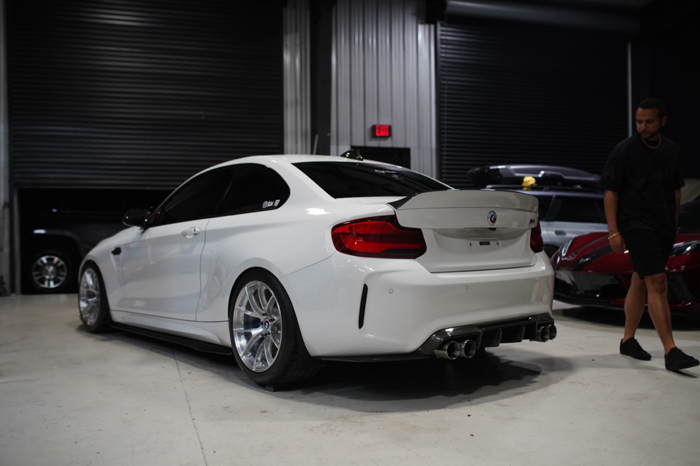 White BMW M2 in the shop bay