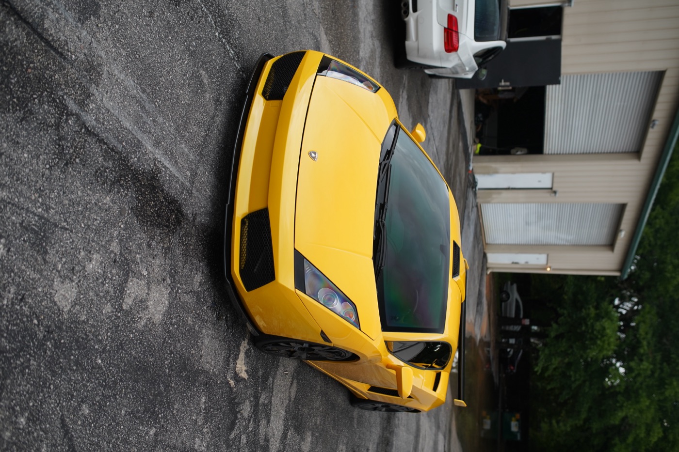 Yellow Lamborghini in the shop lot